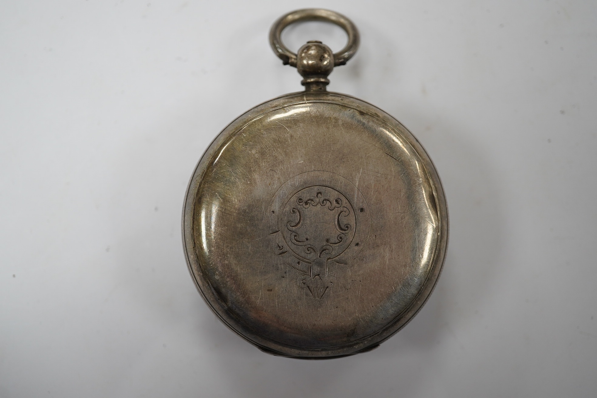 A late Victorian silver open faced keywind pocket watch, with Roman dial and subsidiary seconds. Condition - poor